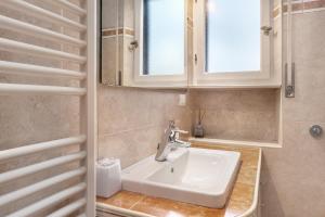 a bathroom with a sink and a mirror at Albachiara in Rapallo +30 photos