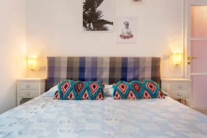 a bedroom with a bed with two pillows on it at Albachiara in Rapallo