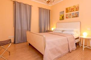 a bedroom with a large bed in a room at Colleincanto Appartamento Lina in Gavardo +22 photos