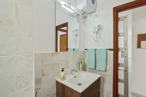 a bathroom with a sink and a mirror at Apartamento Danoe 5 in Mogán +15 photos