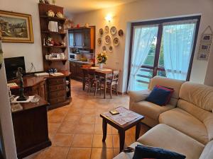a living room with a couch and a table at Trilocale a Santa Maria Maggiore in Santa Maria Maggiore