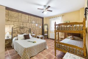 a bedroom with two beds and a bunk bed at Capricho in Cieza +23 photos