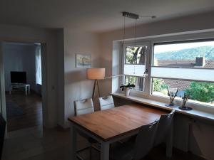 a dining room with a table and a window at Ferienwohnung Bieniussa 3 in Gemünden