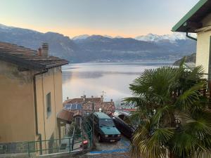 a view of a lake with cars parked in a parking lot at Bernhouse in Dorio