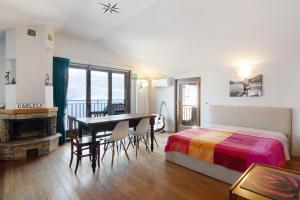 a bedroom with a bed and a desk and a table at Bernhouse in Dorio