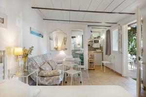 a living room with a couch and a table at La Posada de la Pinaleta in Chiclana de la Frontera