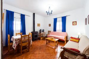 a living room with a couch and a table at Chalet Bellavista in Conil de la Frontera
