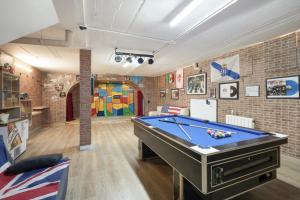 a billiard room with a pool table in it at Villa Can Camarassa in Cervelló