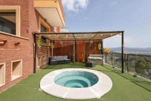 a small pool on the back of a house at Villa Can Camarassa in Cervelló
