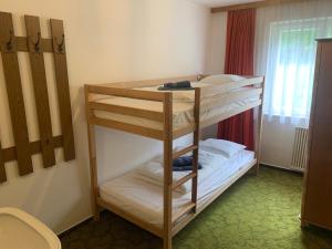 a bunk bed room with two bunk beds in it at Ferienwohnung Durst 2 in Mayrhofen