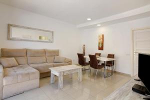 a living room with a couch and a table at Ca Luis in Mogán