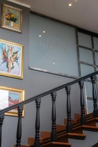 a sign on the wall above the stairs in a house at B&B InVilla in Naples +47 photos