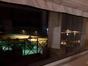 a view from a window at night at A View From The Attic Window in Kyparissia