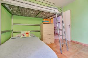 a bedroom with a bunk bed and a ladder at La Casa De Enzo in Playa de las Americas +12 photos