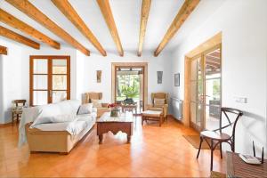 a living room with a couch and a table at Can Xisco in Artá +60 photos