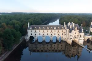 an aerial view of a castle on the water at Gîte La Clématite in Mosnes