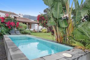 a swimming pool in front of a house at El Bebedero de Los Sauces in San Andres y Sauces