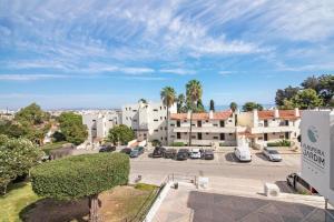 a view of a parking lot with cars parked at White Studio and Terrace in Albufeira