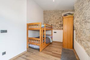 a bedroom with a bunk bed in a room at Cantó el Sech in Montoliu de Segarra