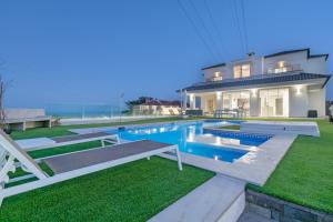 a house with a swimming pool in the yard at Private Villa Candelaria in Candelaria