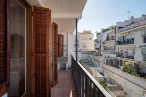 a balcony with a view of some buildings at Canet beach 3 in Canet de Mar