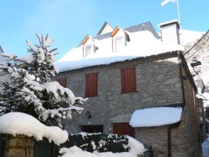 a house with snow on top of it at Ço de Carles in Garós