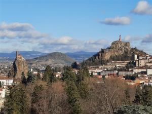 a view of a city with a mountain at Chambre et Table d’Hôtes du Terroir in Borne