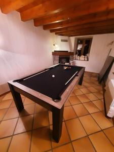 a ping pong table in a room with at Chambre et Table d’Hôtes du Terroir in Borne