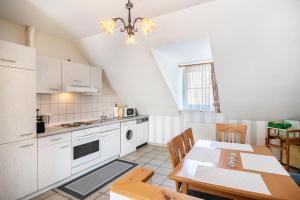 a kitchen with a table and a dining room at Ferienwohnung 4 in Bernkastel-Kues