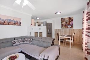 a living room with a couch and a table at Apartamento Porís in Arico
