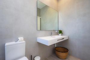 a bathroom with a white sink and a mirror at Son Crespi Vell 2 in Manacor +23 photos