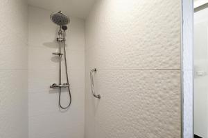 a bathroom with a shower with a glass door at Chambre D'hôtes Toi Et Moi - in Pornic +12 photos