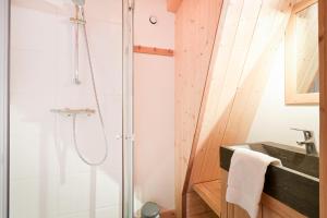a bathroom with a shower and a sink at Chalet Reves des Cimes in Praranger +32 photos