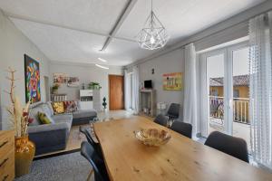 a living room with a table and a couch at Isola Bella Apartment in Barghe