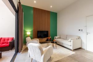 a living room with a couch and a tv at Le Castel in Marseille +12 photos