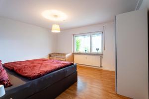 Gulta vai gultas numurā naktsmītnē Ferienwohnung Kinzigtalblick