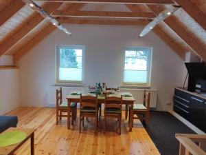 a dining room with a table and chairs at Kleine Auszeit 2 in Forst