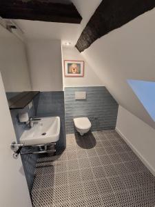 a bathroom with a sink and a toilet at Thum'scher Hof in Ortenberg +45 photos