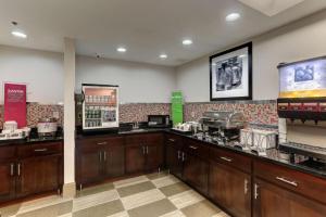a restaurant with wooden cabinets and a counter top at The Antioch Inn in Nashville