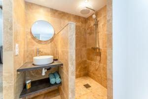 a bathroom with a sink and a mirror at La Velle in Mornas +20 photos
