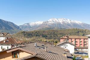 a view of a town with mountains in the background at Appartamento Moser P in Levico Terme