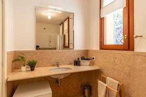 a bathroom with a sink and a mirror at Al Castagneto Foresteria Lombarda in Montevecchia +54 photos