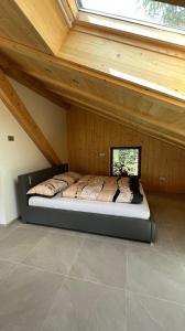 a bed in a room with a roof at Truma Swing Castelfondo in Castelfondo