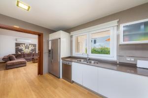 a kitchen with a sink and a counter top at Villa Beatriz in Cala d´Or