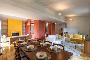 a living room with a table and a couch at Al Castagneto Foresteria Lombarda in Montevecchia