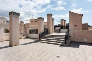 a house with stairs on top of it at Suite Jinetes in Málaga