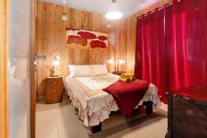 a bedroom with a bed with a teddy bear on a table at Cantinho do Sossego in Várzea
