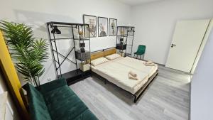 a living room with a bed and a couch at Relax in der Röntgenstadt in Remscheid