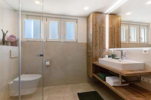 a bathroom with a sink and a shower at Moderner Schwarzwaldtraum in Oberharmersbach +15 photos
