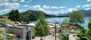 a group of people at a resort near a lake at Appartement Kärntner Seenland in Ledenitzen +11 photos